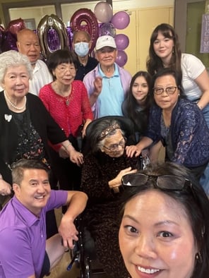 Chiung Hi Chou in the middle surrounded by her family. Samantha, her granddaughter is in the forefront