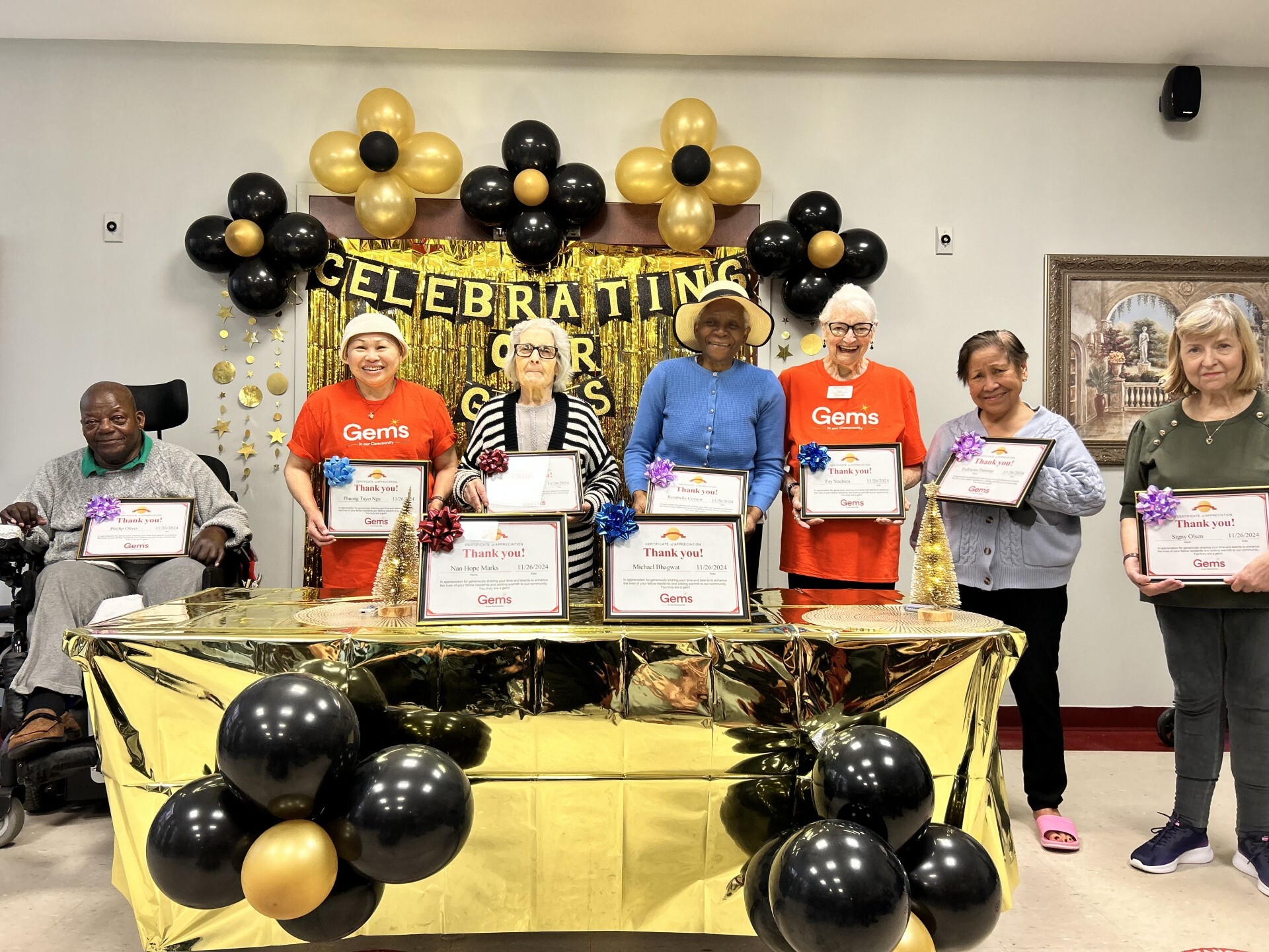 Residents at Weston Terrace Community hold their Gems in the Community Certificates