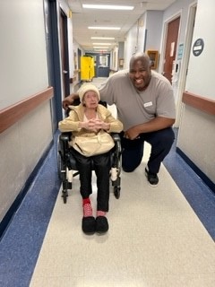 Patrick Jones, Director of Resident Programs and Hilda, a resident at Fieldstone Commons